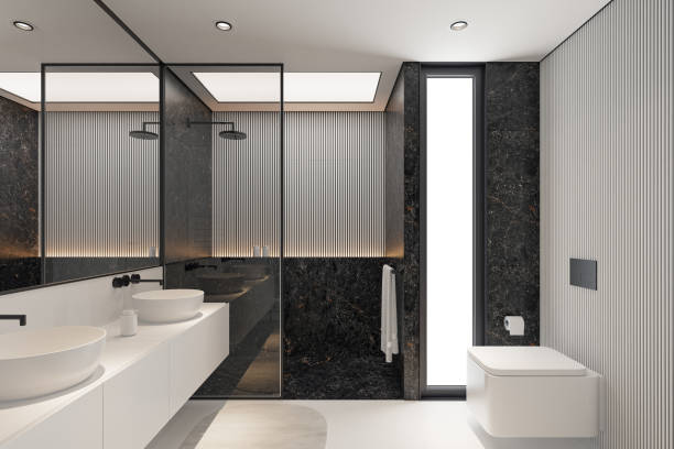 istock Modern Minimalist Black and White Master Bathroom Interior with Double Sinks and Shower with large black marble tiles 2190418156