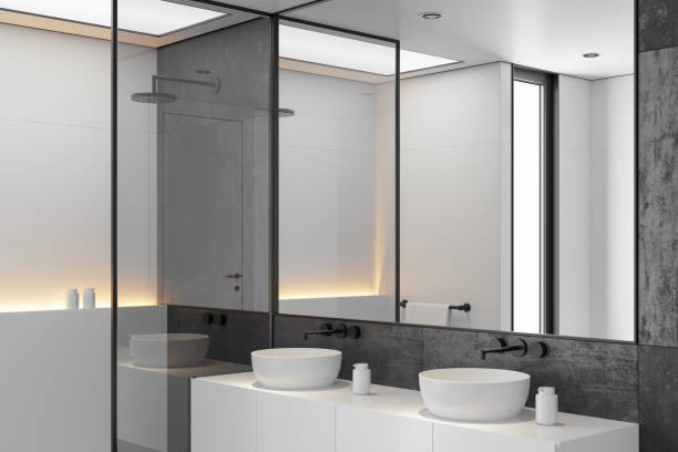 istock Modern Minimalist Black and White Master Bathroom Interior with Double Sinks and Shower with large black marble tiles 2190418394