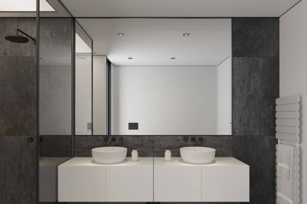 istock Modern Minimalist Black and White Master Bathroom Interior with Double Sinks and Shower with large black marble tiles 2190418395