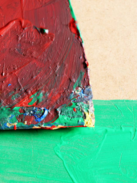 istock Painter's old dirty spatula on green background 2190418950