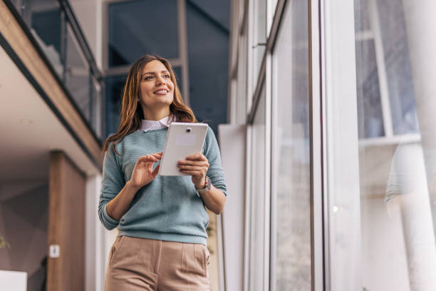 istock On the move, a businesswoman uses a digital tablet 2190421530