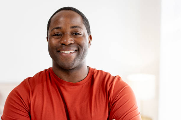 istock Happy middle aged African American man posing at camera at home 2190425036