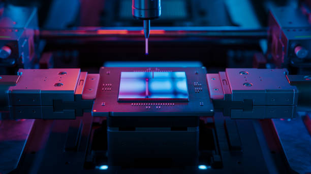 istock Close-up of Advanced Computer Chip illuminated with Red Light in Industrial Environment. Microchip on Conveyor Line during Production and Packaging Process on Semiconductor Fab 2190425425