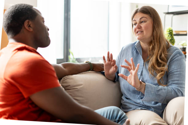 istock Plus size woman explaining for man, gesturing with hands at home 2190426301
