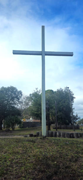istock A cross standing tall in the blue sky 2190426511