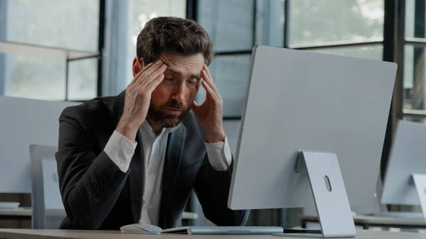 istock Tired Caucasian bearded 40s middle-aged businessman employee man typing laptop feel failure upset with lost of information online error stressed look at computer screen suffer from headache pressure 2190426708
