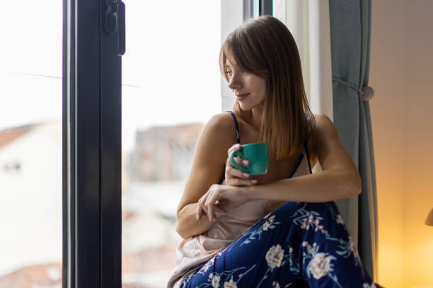 istock Woman drinking morning coffee 2190427537