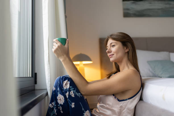 istock Woman drinking morning coffee 2190427541
