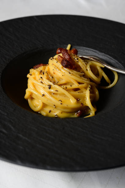 istock Spaghetti Carbonara Italian Pasta with an Egg and Cheese Sauce 2190428175