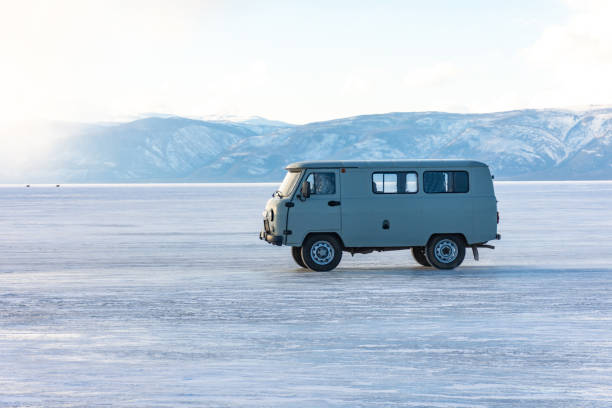 istock A white van is driving on a snowy road 2190429495