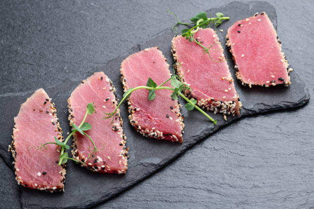 istock Sliced tuna steak with sesame photography . Top view 2190430043