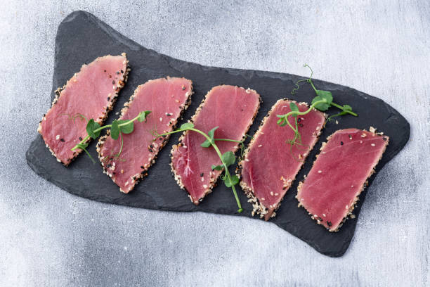 istock Sliced tuna steak with sesame photography . Top view 2190430084