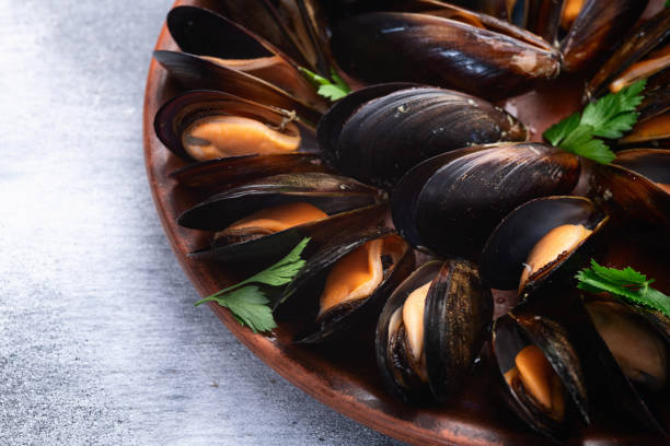 istock Mussels with parsley on a plate photography 2190430096