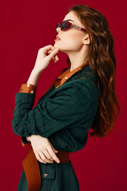 istock pretty woman wearing sunglasses suit isolated background side view 2190430332