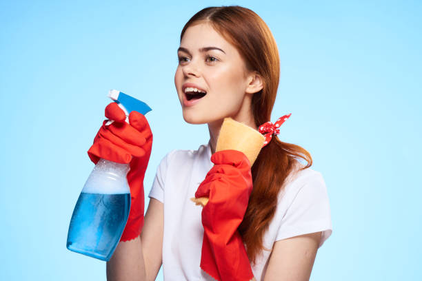 istock professional cleaning lady service housework blue background 2190431016