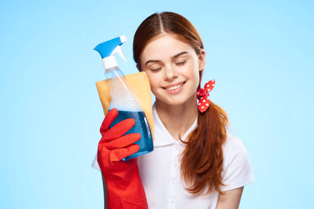 istock professional cleaning lady home care blue background 2190431792