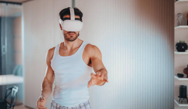 istock Man at home practicing Tai chi with VR glasses 2190431812