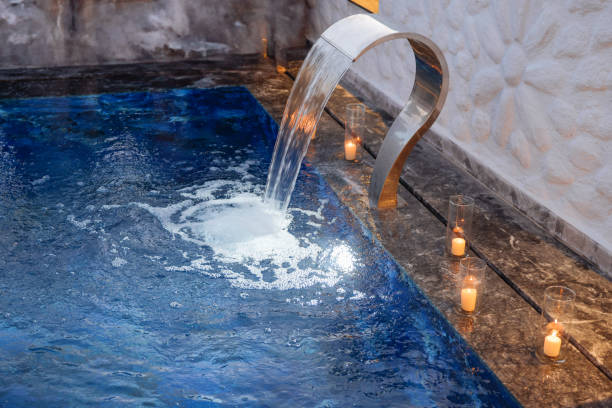 Swimming pool stairs going directly into the water. Nothing like relaxing to the sound of the waterfalls at a resort. Comfort and class all day long.