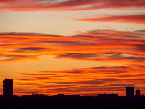 istock cityscape sunset with vibrant colors and dramatic clouds 2190436394