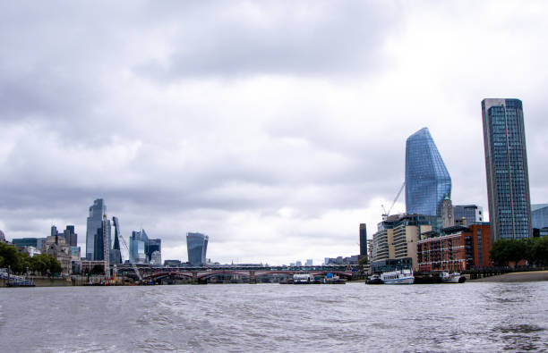 The River Thames, in London, is one of the most famous rivers in the World. Here seen a view looking along with various landmarks and buildings that surround it.