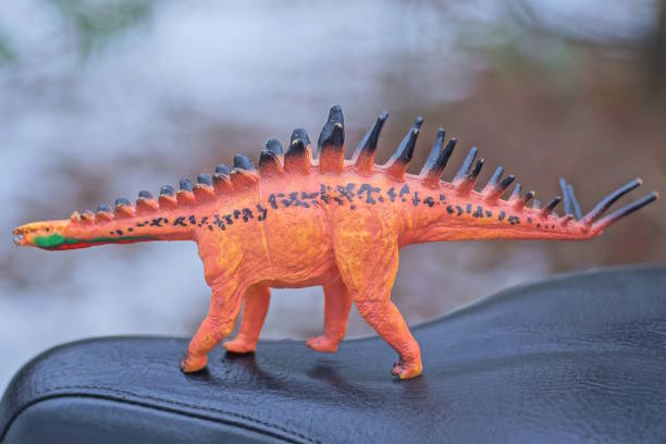 istock one small red brown plastic toy dinosaur 2190437319
