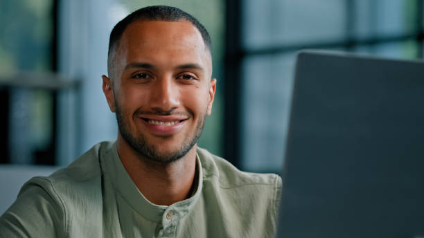 istock African American businessman in office pensive think pondering problem solution business strategy looking camera with smile. Multiracial man male employer entrepreneur thinking planning smiling happy 2190438716