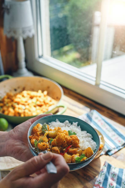 istock Indian Aloo Gobi Chicken Curry Served with Rice 2190439459