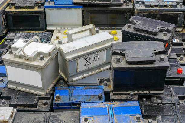 istock Stack of many used car batteries for recycling in a hazardous waste facility 2190441289