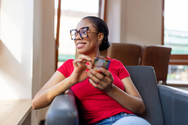 istock Woman Relaxing in a Cafe with Smartphone 2190441900