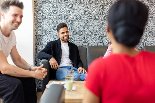 istock Diverse Friends Chatting in Modern Cafe 2190441964