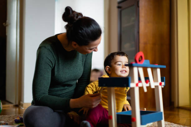 istock Mother and Child Playing with Tablet at Home 2190442346
