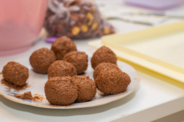 Tiny little homemade chocolate cakes, chocolate balls, making cakes, holiday preparing