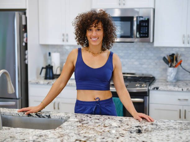istock Woman Warming a Ready-to-Eat Meal in a Home Kitchen 2190447851