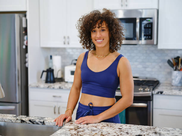 istock Woman Warming a Ready-to-Eat Meal in a Home Kitchen 2190447867