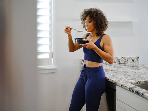 istock Woman Warming a Ready-to-Eat Meal in a Home Kitchen 2190447928