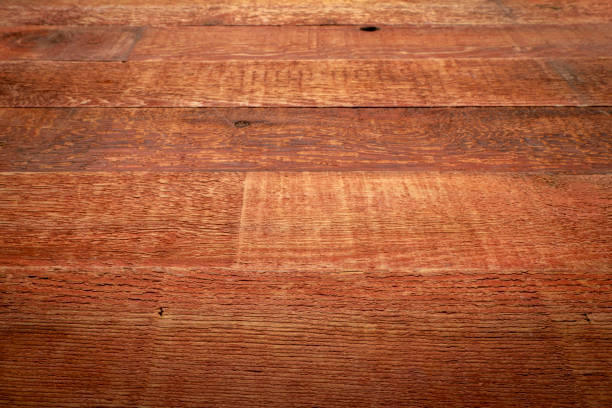 rustic weathered red barn wood background with grain and knots