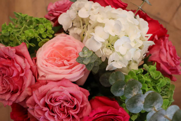istock Delicate bouquet featuring pink roses, white hydrangeas, and vibrant green accents, complemented by eucalyptus leaves, creating a fresh and elegant floral arrangement. 2190453487