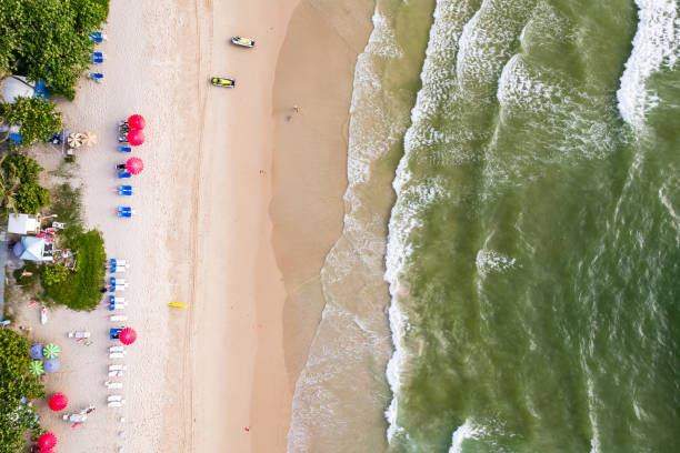 istock Top view beach with waves crashing on sandy shore,Beautiful waves sea surface in summer seascape background,Amazing beach colorful water background 2190454986