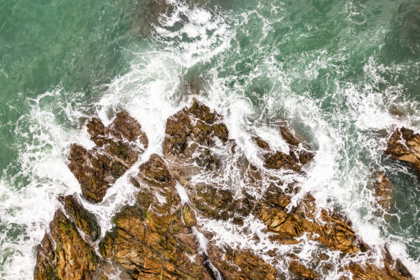 istock Bird eye view seashore with waves crashing on rock cliff, Beautiful waves sea surface in sunny day summer background, Amazing seascape top view seacoast landscape view 2190455073