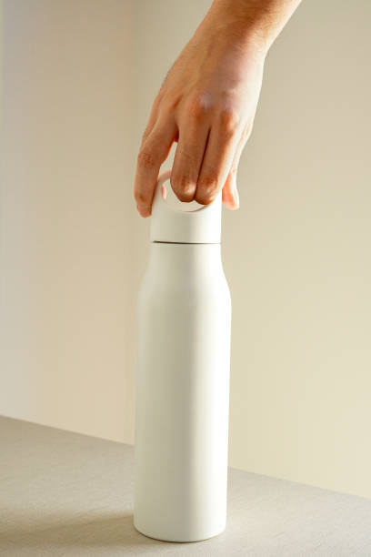Man holding white Stainless Steel Water Bottle with handle on white background , Mockup