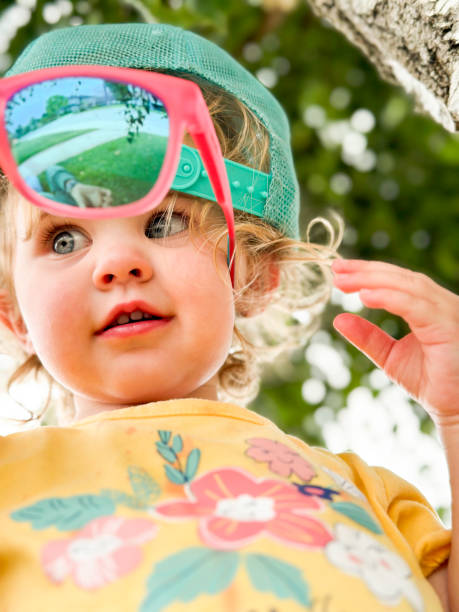 Portrait of beautiful baby with backwards hat