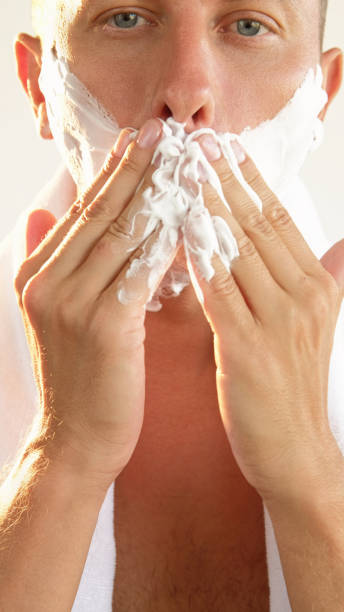 istock Shaving face skin treatment care man applying foam 2190458768