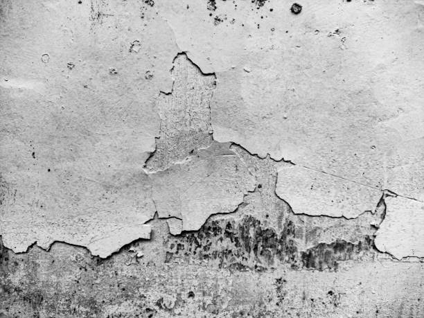 istock Texture of a cracked and peeling paint on a rough concrete wall 2190472031