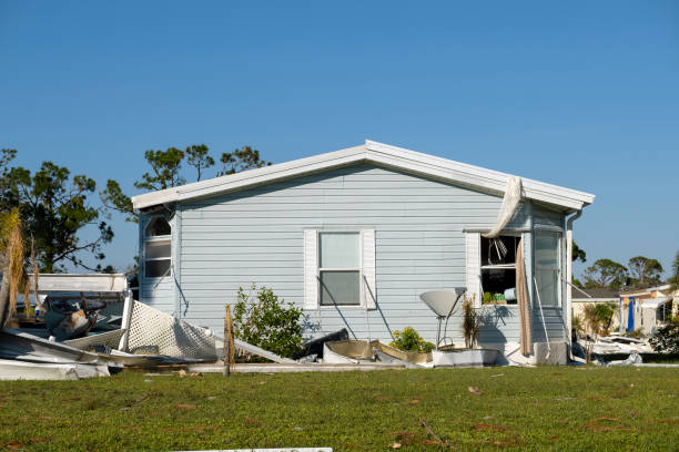 Collapsed and damaged mobile homes after hurricane swept through Florida residential area. Consequences of severe natural disaster.