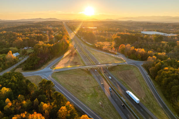 istock American highway bridge with fast moving traffic area in evening. Interstate transportation concept 2190474595