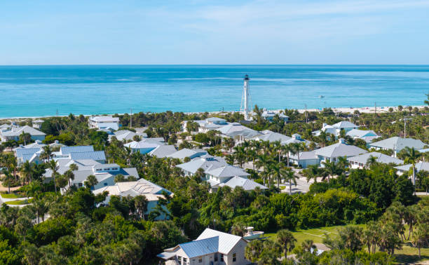 istock White lighthouse on sea shore for commercial vessels navigation at wealthy waterfront neighborhood in island small town Boca Grande on Gasparilla Island in southwest Florida, USA 2190474632