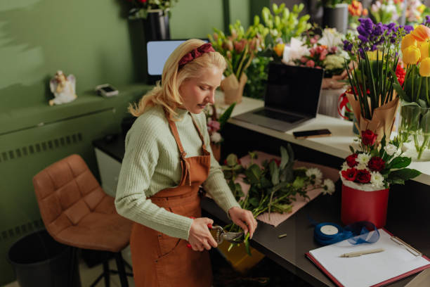istock Florist arranging bouquets in cozy shop 2190475924