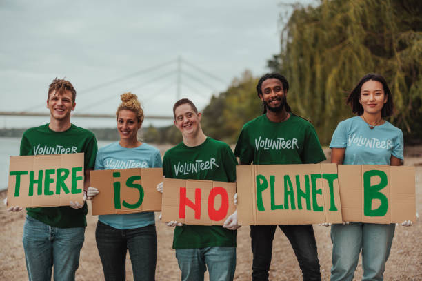 istock Volunteers showing there is no planet b sign by the river 2190476194