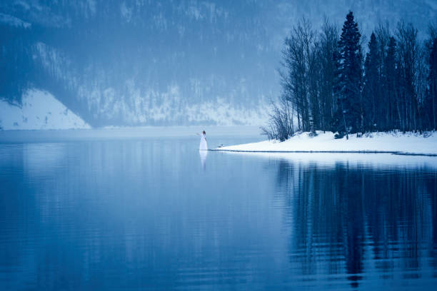 Woman embraces solitude in winter, Yukon