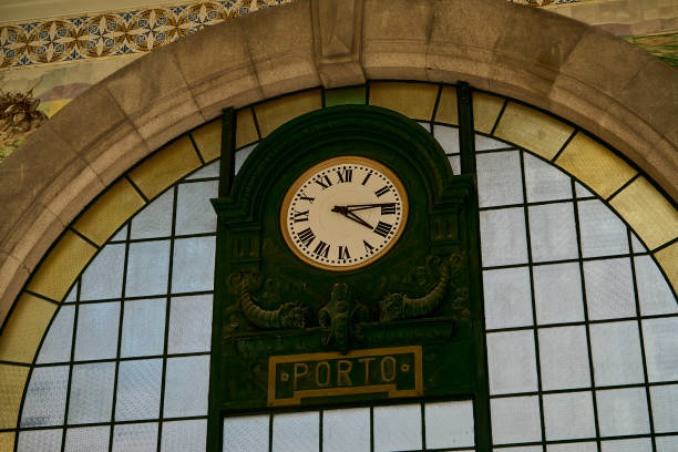 Clock in the interior of Portol Sao Bento Minho railway station. Porto, Portugal.